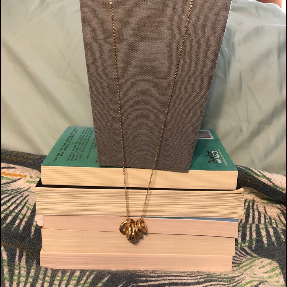 Gold colored necklace with golden rings